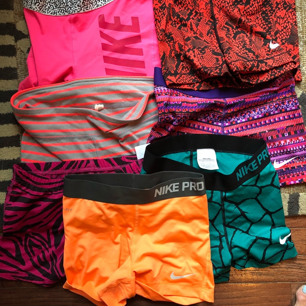 7 pair of athletic spandex 5 Nike, 1 UA, 1 Adidas